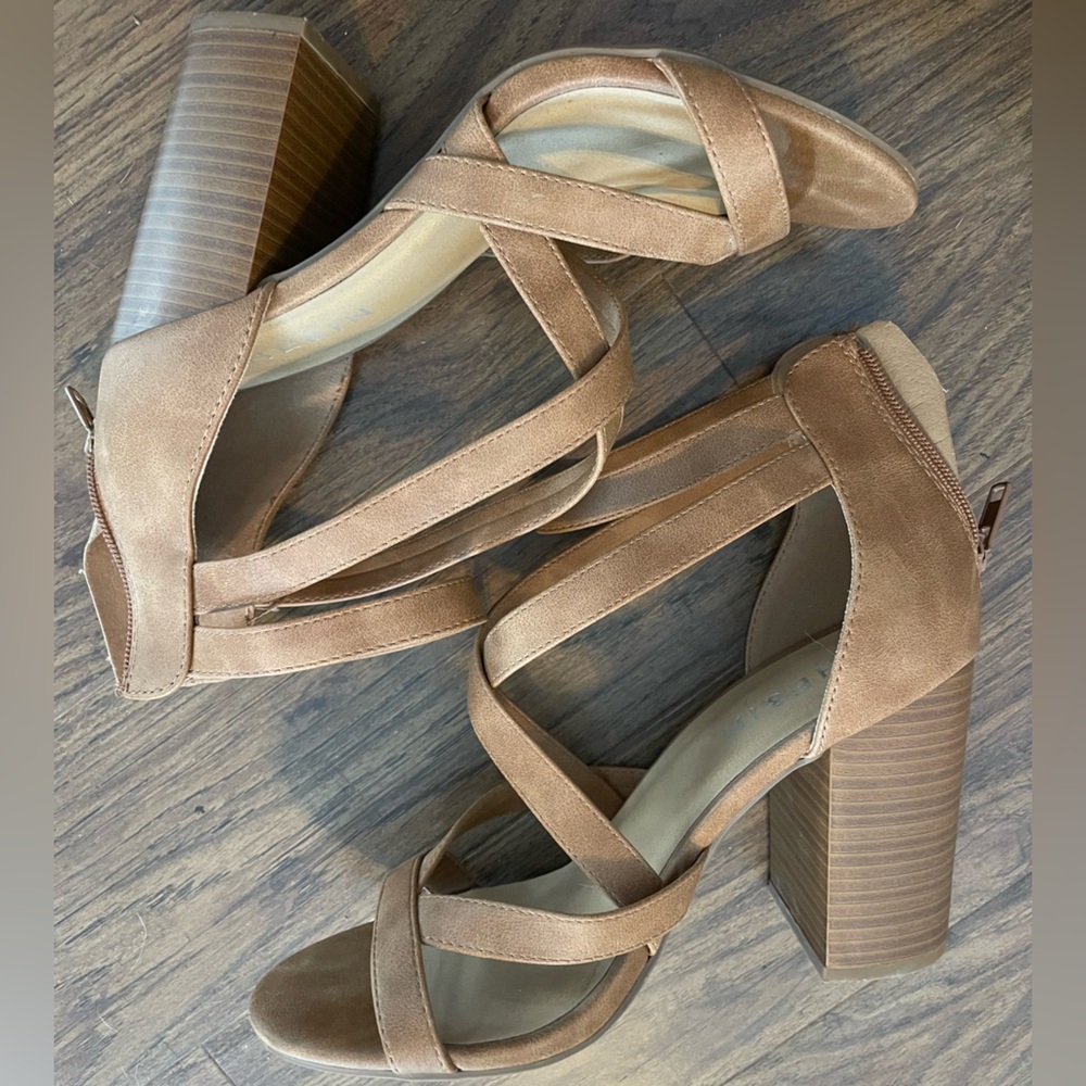 Brown faux leather strappy heels.